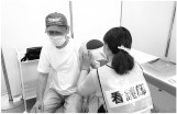 写真:ワクチン接種の様子