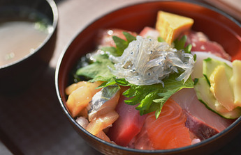 Seafood rice bowl with fresh sardine fry photo